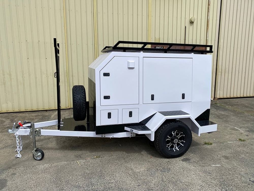 Single axle tradie trailer with roof rack and spare wheel